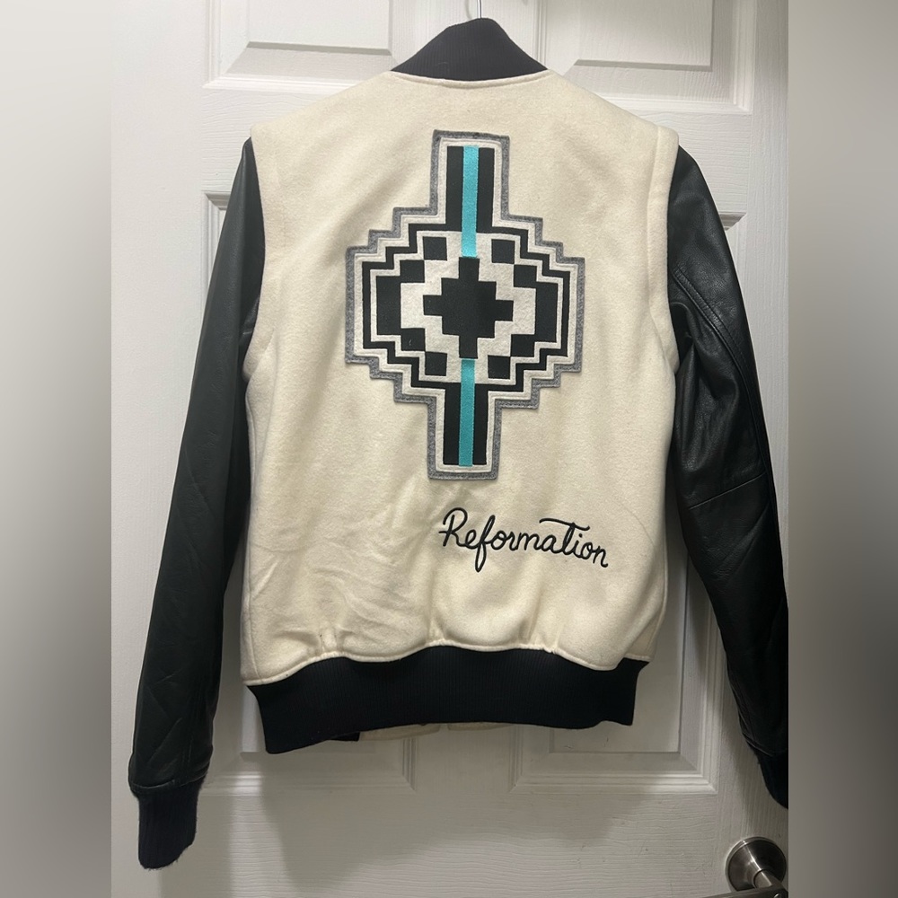 Nike leather and polyester women’s varsity jacket